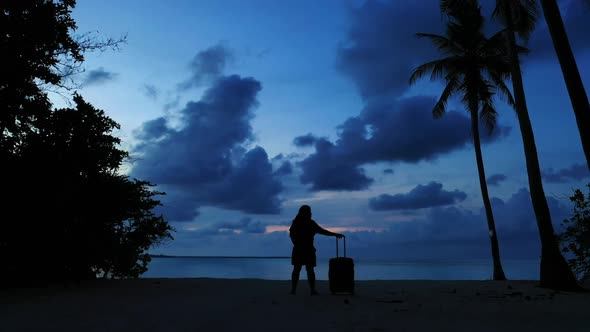 Tourist enjoys life on tropical seashore beach holiday by aqua blue ocean with white sand background