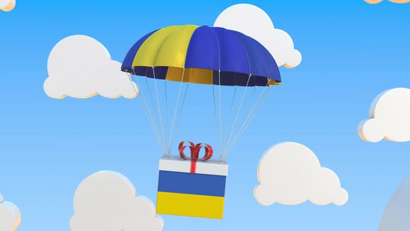 Carton with Flag of Ukraine Falls with a Parachute