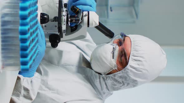 Vertical Video Research Scientist in Ppe Suit Conducting Vaccine Development