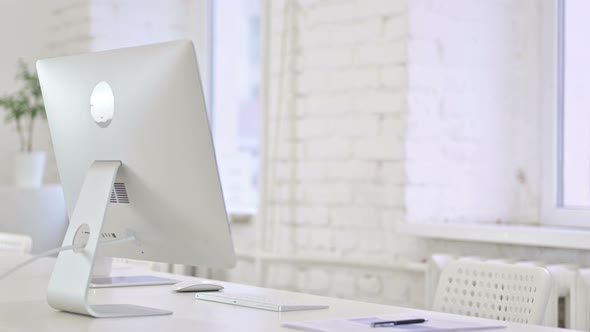 Young Latin Woman Coming and Sitting on Office Desk 