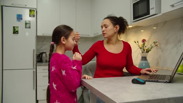 Caring Mother Touching Forehead of Daughter Detecting Fever at Home