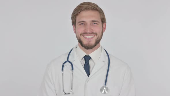 Smiling Young Doctor on White Background