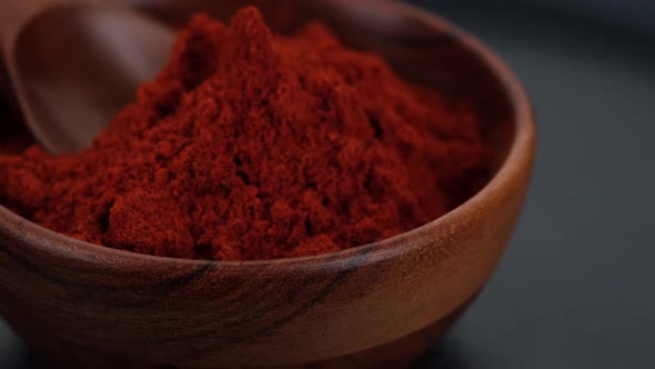 seasoning sweet smoked paprika in wooden bowl