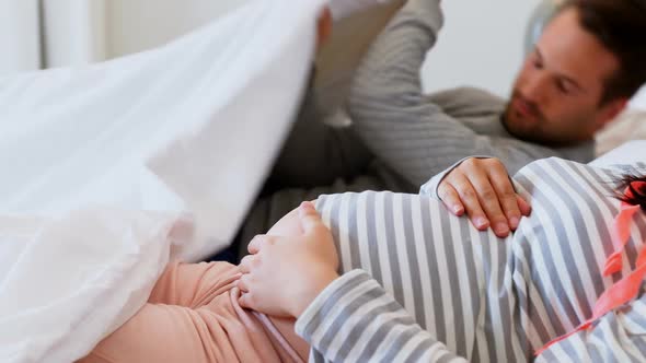 Pregnant woman sleeping on bed in bedroom 4k