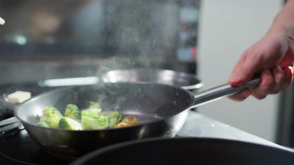 Frying Broccoli and Potato on Skillet