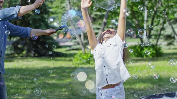Kids having Fun at Bubbles Artist Performance in Park alt