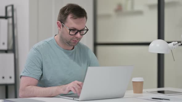 Yes Gesture By Head Shake By Young Man at Work