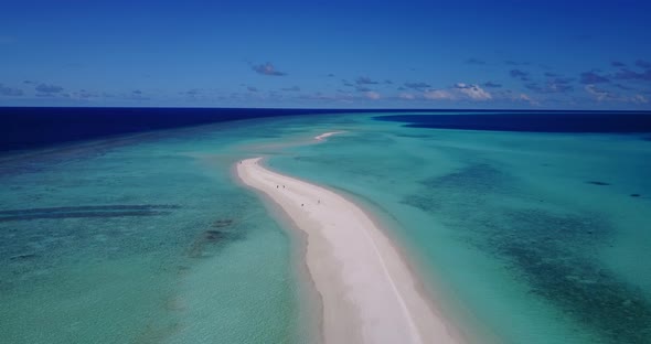 Natural fly over clean view of a summer white paradise sand beach and blue ocean background 