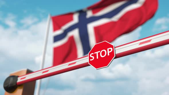 Barrier Gate Being Opened Near Flag of Norway alt