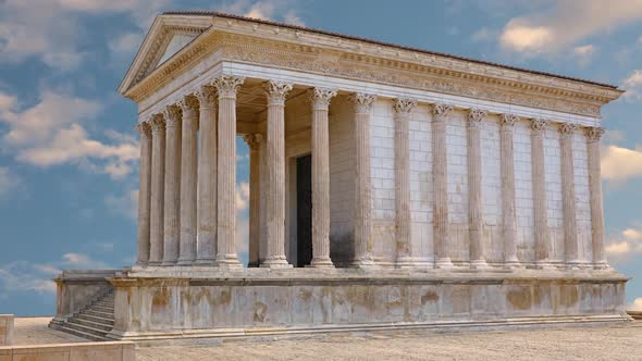 Facade of antique Roman temple over blue sky