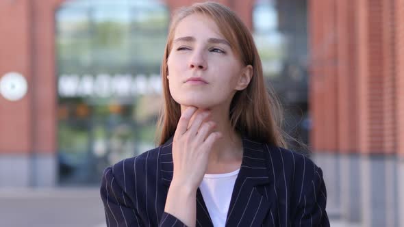 Portrait of Thinking Business Woman Outside Office