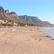 Beachgoers enjoying a lovely sunset on Camps Bay beach with a mountain backdrop - VideoHive Item for Sale