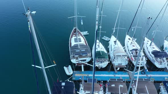 Top down view of yachts in the marina. Sailboats and regular Boats moured