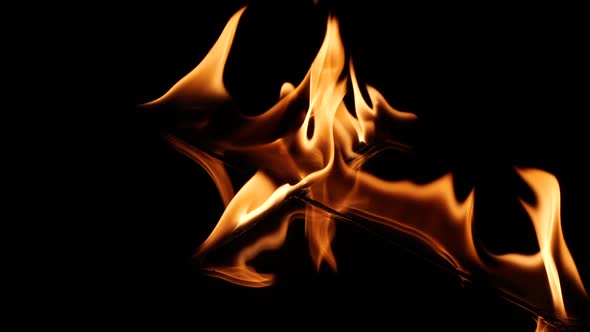 Slow Motion Fire Flame of Cross Shape Burn Over Black Background Design Element