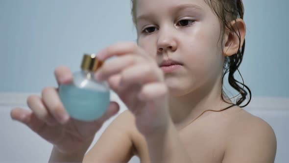 Caucasoid Preschool Girl Takes a Bath