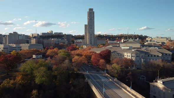 A slow aerial push in to the Cathedral of Learning tower on Pitt's campus in the Oakland district of