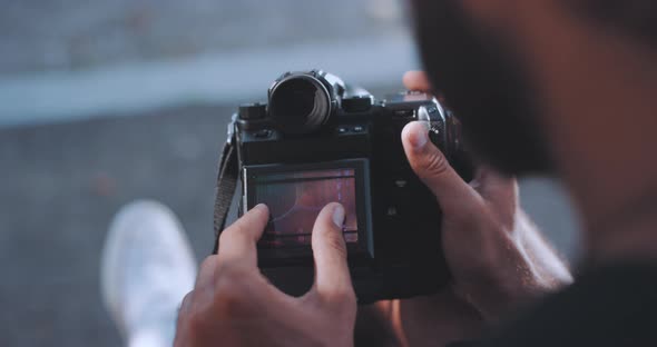 Photographer zooms in on camera image display