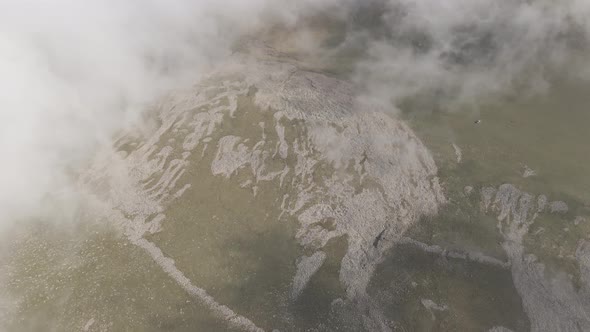 Scenic aerial view of moving white clouds at Abuli Mountain. Georgia