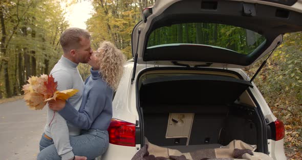 Loving Couple in Jeans on a Date in the Autumn Park