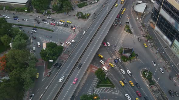 Traffic on Crossroad on Street. From Above Modern Cars and Motorcycles Driving on Intersection on