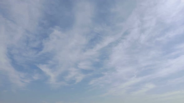 Time lapse of white cloud moving pass around sky background