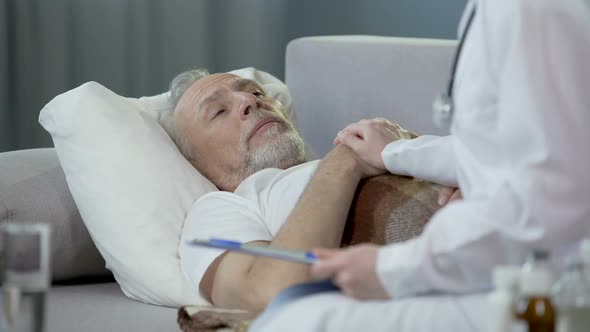 Retired Man Lying in Bed and Chatting With Physician, Healthcare and Medicine