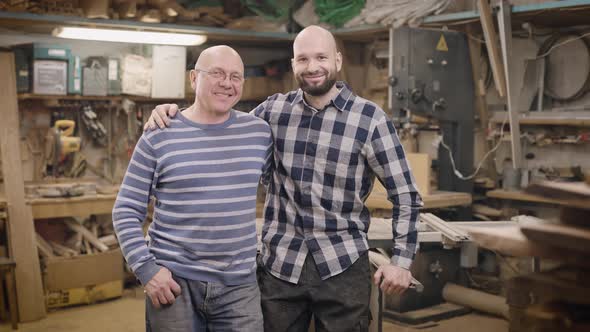 Father and Son in Their Family Carpentry Workshop