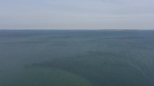 An aerial view over the Peconic River on Long Island, NY. The drone camera truck left and pan right