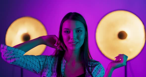 Fashion Model Woman in Colorful Bright Lights Posing Portrait of Beautiful Sexy Girl with Trendy