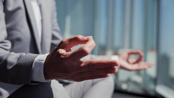 Adult Woman Doing Yoga Exercise at Work Near Panoramic Window Relaxing