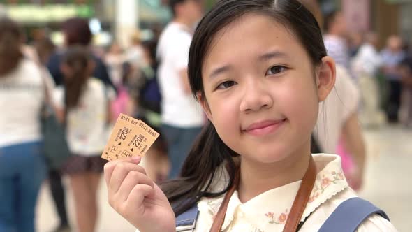 Asian Girl Showing Train Ticket While Travel In Japan