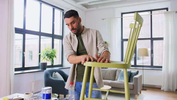 Man or Blogger Showing Old Chair Renovation