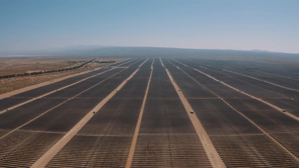 Aerial Pan over a huge solar panel field in the Mojave Desert, California
