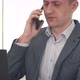 Adult Businessman Talking on Phone in Office - VideoHive Item for Sale