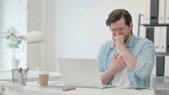 Young Man Laptop Coughing Work