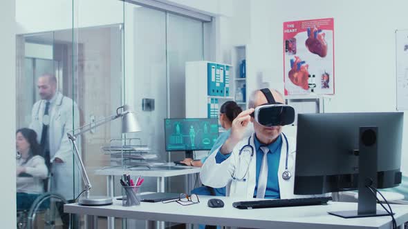 Senior Physician Using VR Glasses in Modern Private Clinic