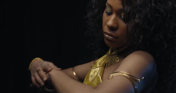 Close Up of a Woman with Slim Figure in Gold Dress, Belly Dancing, 