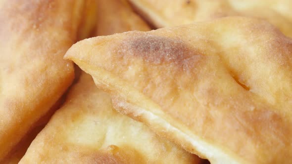 Tasty fried buns made in hot oil slow tilt 3840X2160 UltraHD footage - Close-up of golden  pirozhki 