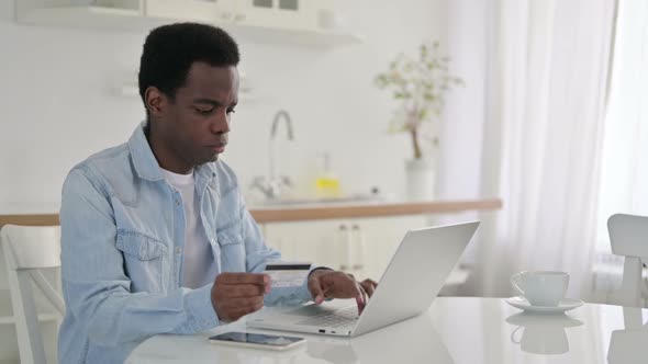 Online Payment Failure on Laptop for African Man at Home