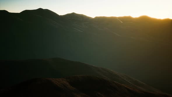 Hills with Rocks at Sunset