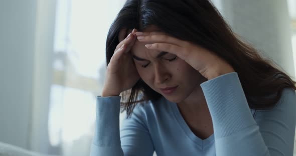 Close Up Portrait of Exhausted Young Woman Suffering From Migraine, Panic Attack, Slow Motion