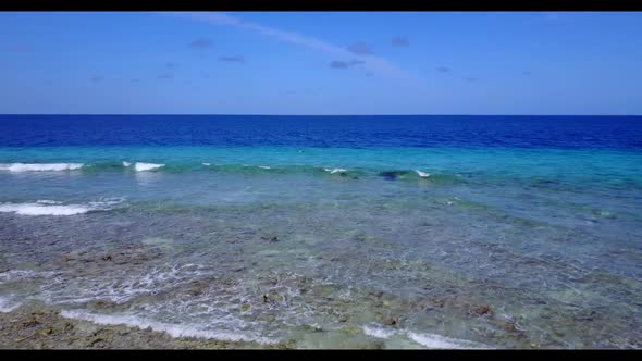 Aerial landscape of exotic tourist beach break by blue sea with white sandy background of adventure 