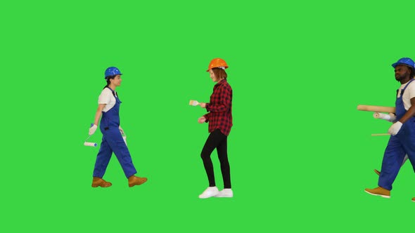 Many People of Different Construction Professions Walking By on a Green Screen Chroma Key