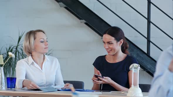 Female Workers Are Working in Office, Having Phone Calls and Paper Work