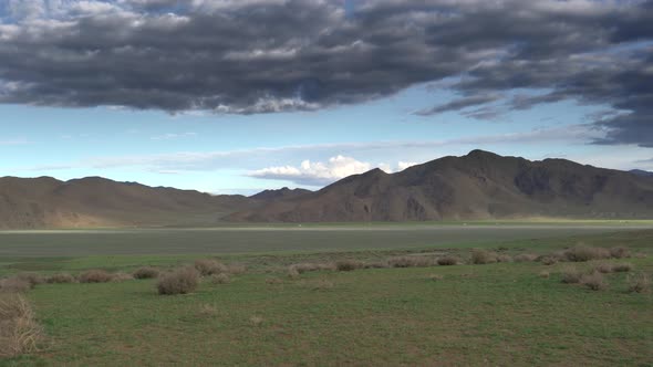 Green Flat Plain Next to Treeless Hills