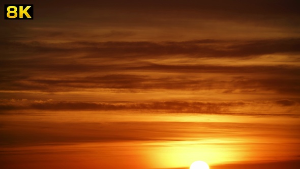 Sunset Through the Lined Layer Clouds