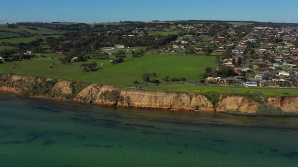 AERIAL TILT DOWN Limestone Cliff Face Of Clifton Springs, Australia