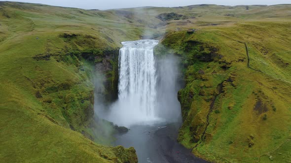 Aerial Circle Fly Above Skogafoss Waterfall on Skoga River on South Iceland in Summer