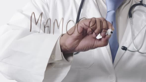 Asian Doctor Writing Mamogram