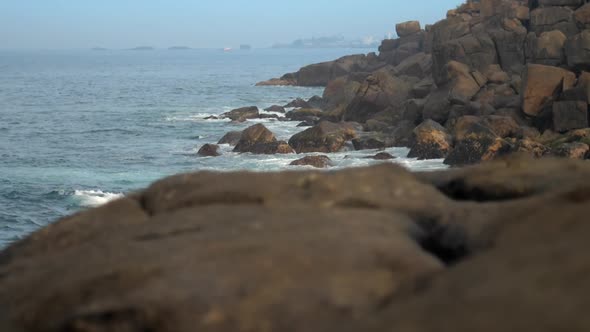 Ocean Bay with Steep Rocky Shore and Reefs Slow Motion